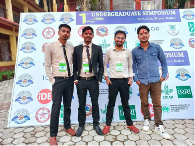 Saurab and three undergraduate friends posing outside at the first undergraduate symposium
